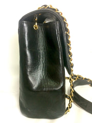 Vintage CHANEL black lamb leather 2.55 classic square shape shoulder bag with golden CC and chain strap. Elegant purse