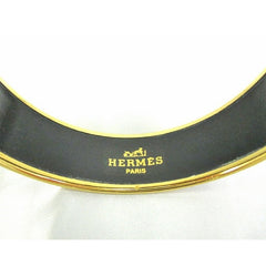 Vintage Hermes cloisonne enamel golden thick bangle, bracelet with tiger and crown design in gold and blue.