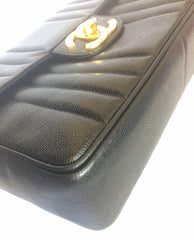 Vintage CHANEL black 2.55 jumbo caviar leather large shoulder bag with golden CC Vertical stitch. Classic caviar leather