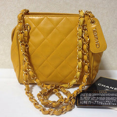 Vintage CHANEL lucky fortune color of yellow, lambskin classic chain shoulder bag with a CC stitch mark and logo charm pull. Daily purse