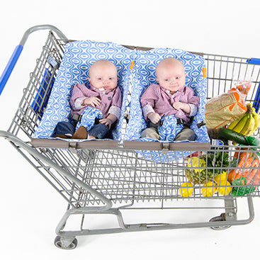 Two babies in shopping cart slings