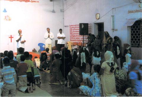 Rev. Benjamin's church praying.