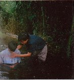 Our missionary, Joseph Nan, baptizing a new believer in Myanmar.