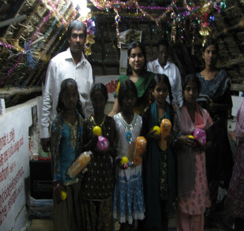 Some girls from a poor village with Christmas gifts they were given.