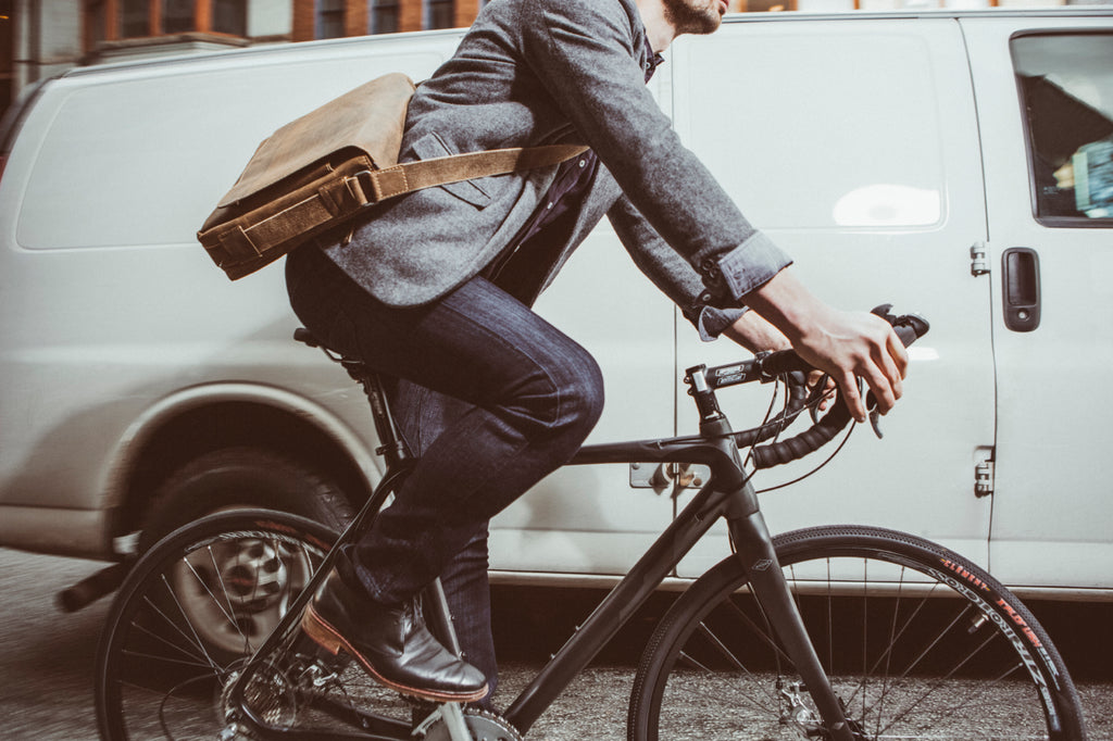 Man on bike dressed in DU/ER Jeans - available at Le Velo Victoria