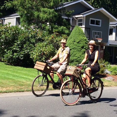 Le Vélo founder Susan and husband riding a bike