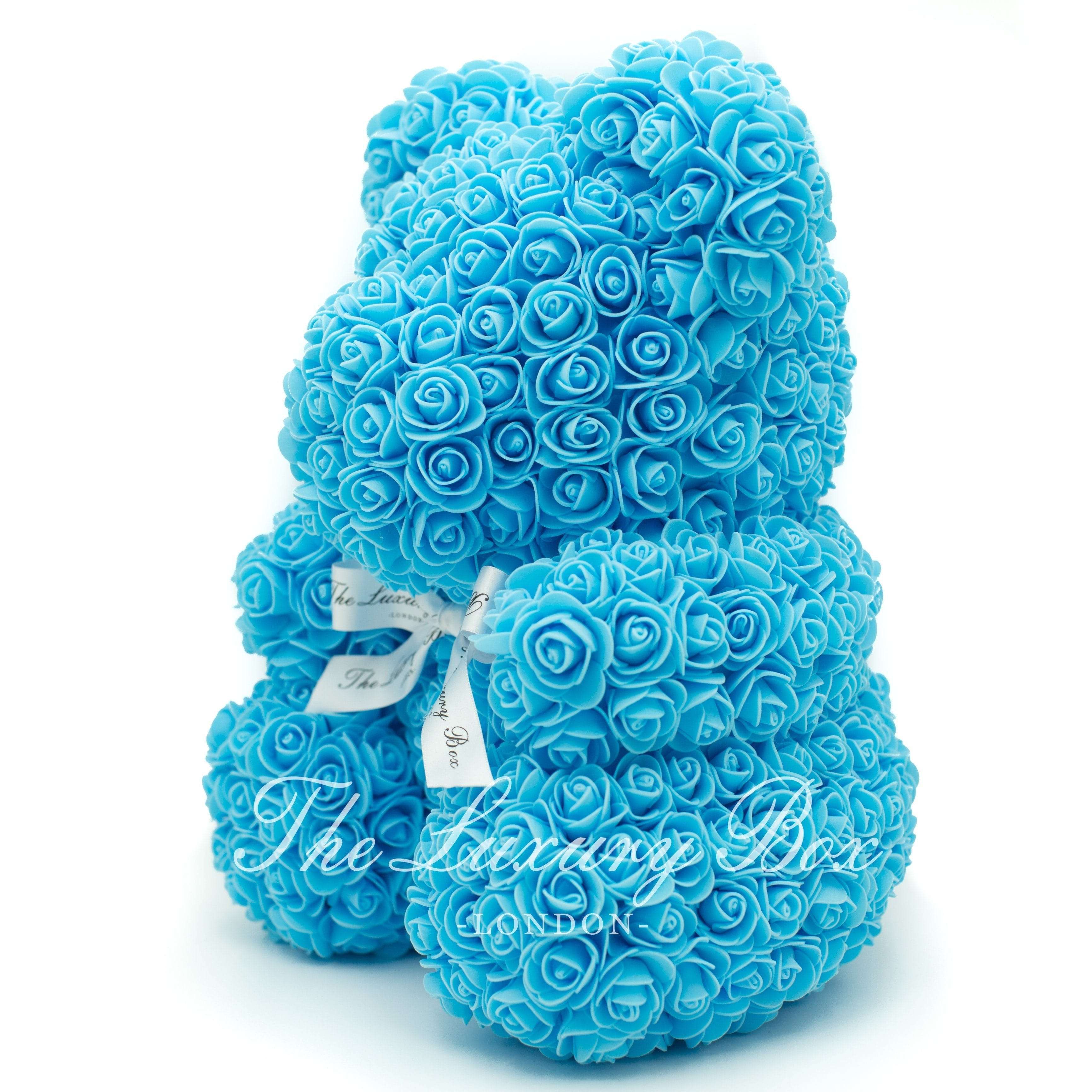 teddy bear with blue roses