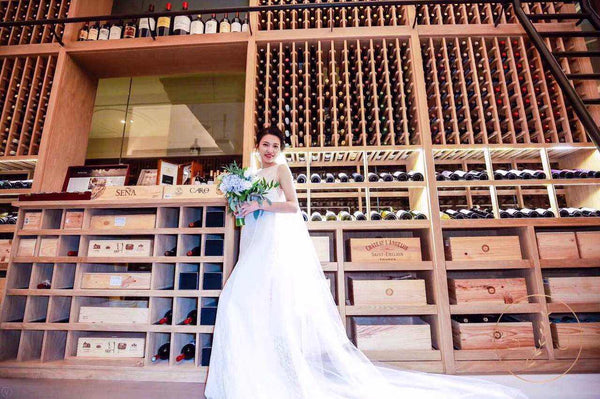 peony rice chinese bride in a bridal gown holding a bouquet of flowers 