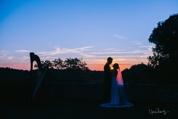 Peony Rice chinese bride wearing a wedding dress and groom sunset elopement photo