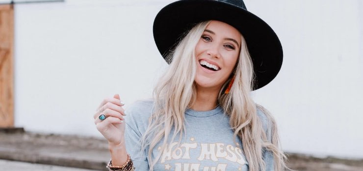 model wearing a black Venice wide brim hat