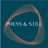 Press & Still logo over copper spiral and deep cerulean background.