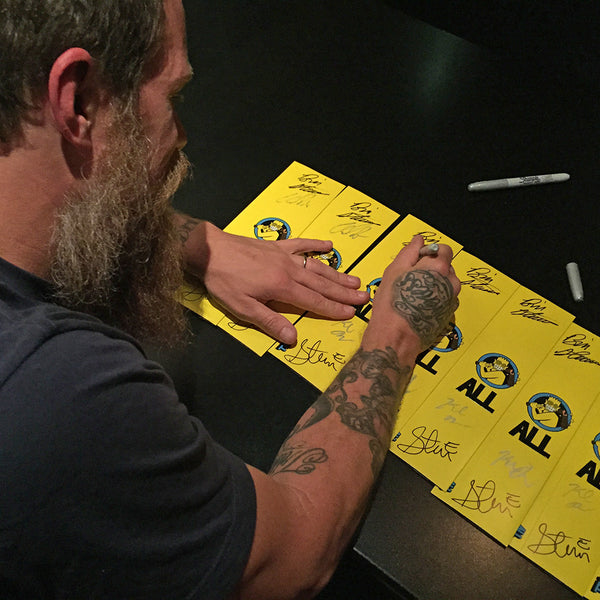 Chad Price signing ALL Watch packaging.