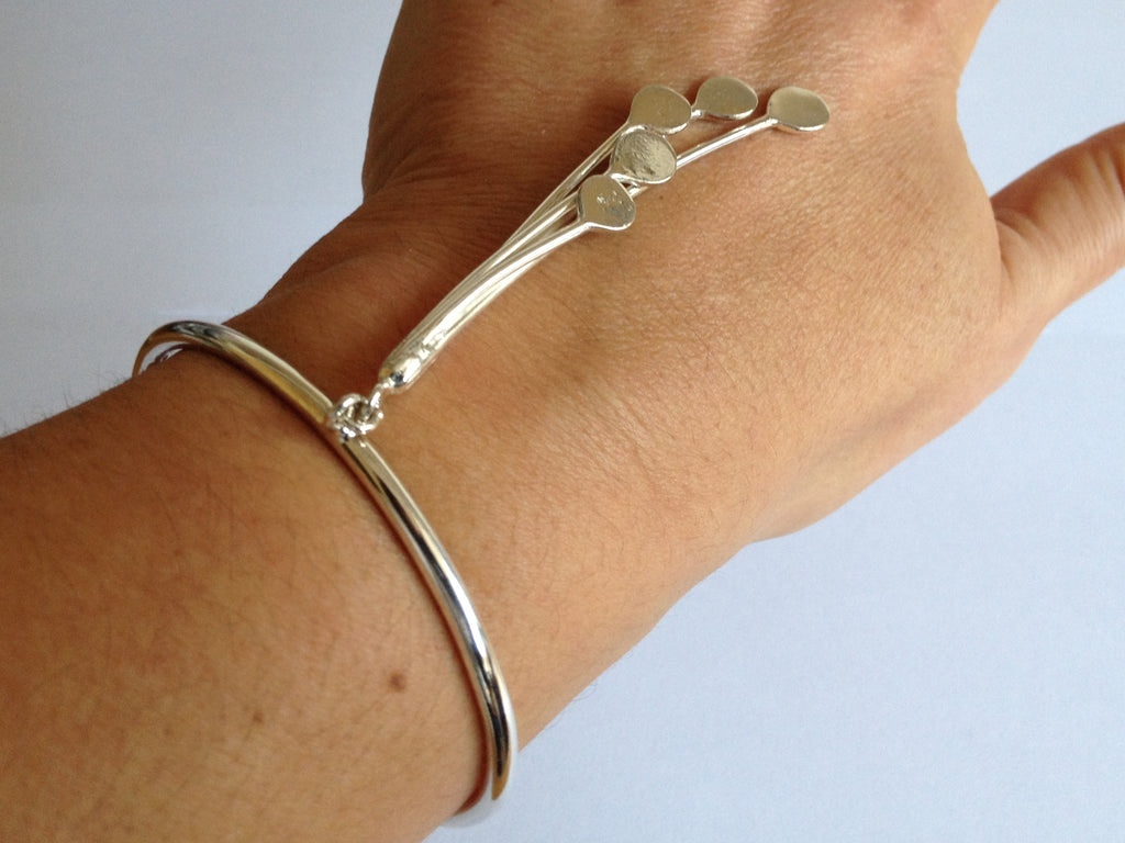 Cascade Starburst Dangling Silver Bangle