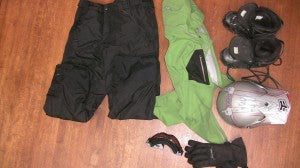 What to wear while snowmobiling - jacket and pants.