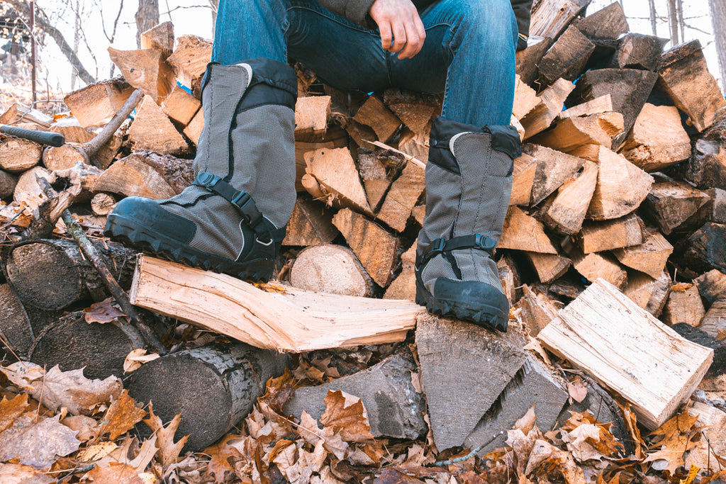 wearing overshoes wood pile cutting wood