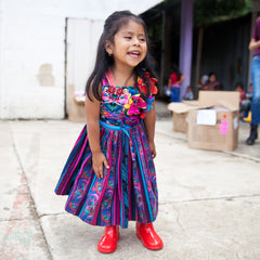 roma foundation guatemala girl in red rain boots