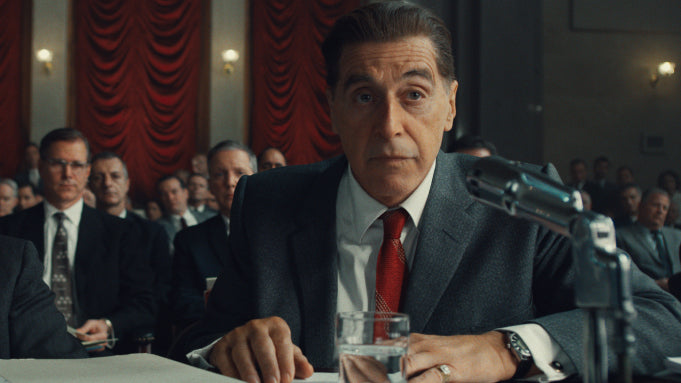 Hoffa in a wool suit and red gold striped skinny tie during a union meeting