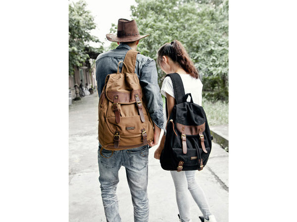 Couple sporting the Serbags canvas & leather backpacks