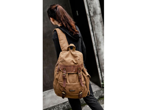 Woman wearing the Serbags brown canvas and leather rucksack