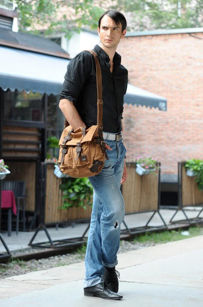 man wearing brown military style messenger bag with leather straps by Serbags 