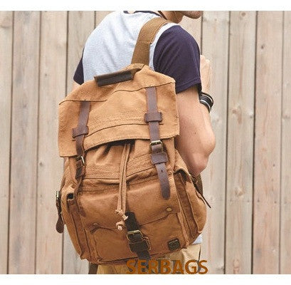 Man wearing the brown Serbags canvas travel backpack 