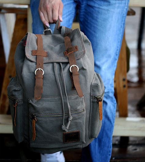 Woman wearing the gray casual canvas backpack with laptop compartment by Serbags