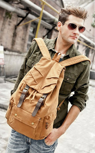 sexy man wearing light brown military canvas backpack
