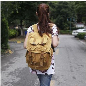 Woman wearing unisex Serbags light-brown military travel backpack