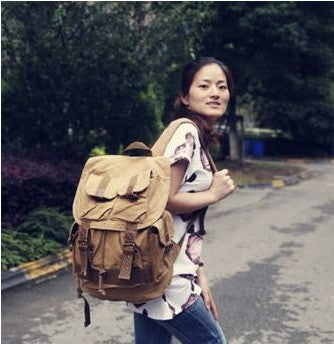 Young traveller sporting the Serbags light-brown military travel backpack