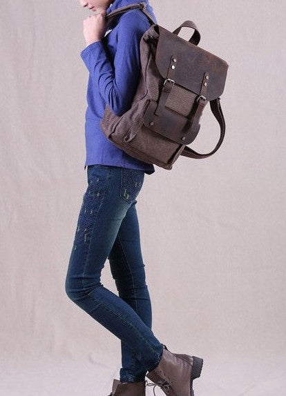 Woman sporting dark brown travel vintage & canvas backpack