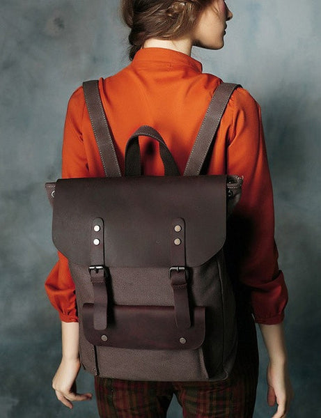 Woman sporting dark brown travel vintage & canvas backpack