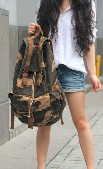 Young woman wearing the Camo Cargo Military Rucksack Backpack by Serbags