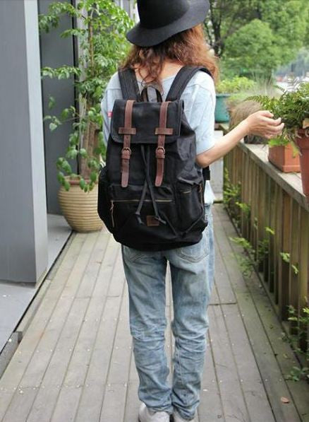 Casual Black Canvas Backpack with Adjustable Shoulder Straps for Work, School & Travel