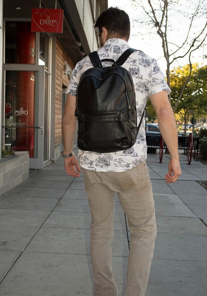 Casual attire & black classic leather backpack by Serbags