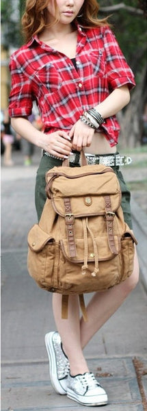 Woman carrying a light brown canvas rucksack backpack by SerBags