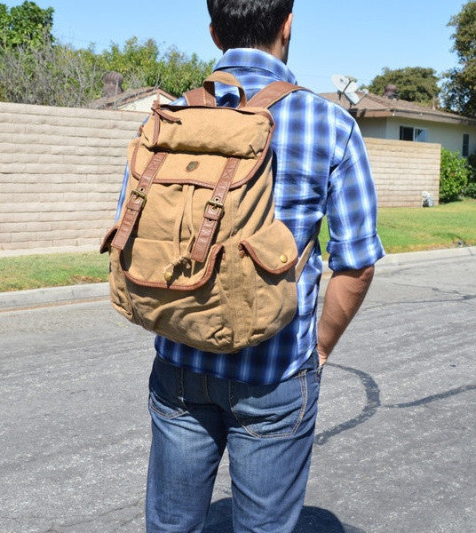 Man wearing the Serbags light brown canvas rucksack backpack
