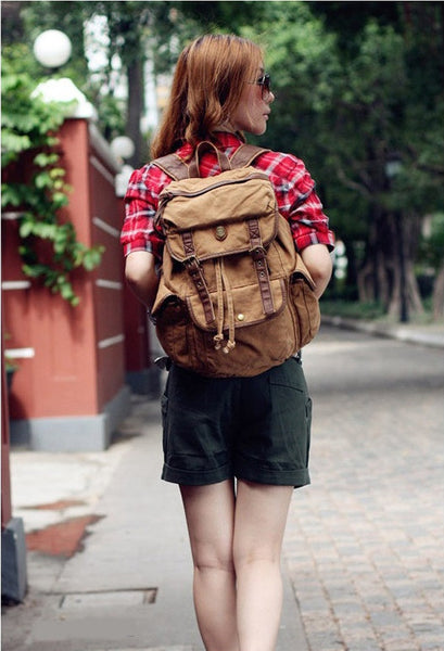 Woman wearing Serbags's light brown school backpack