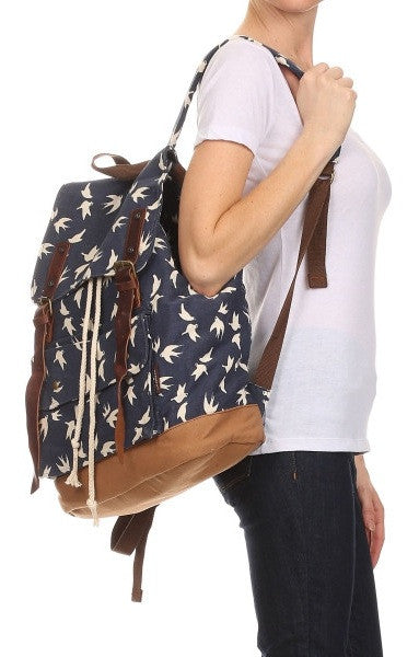 woman wearing the dove art print school rucksack for girls by Serbags