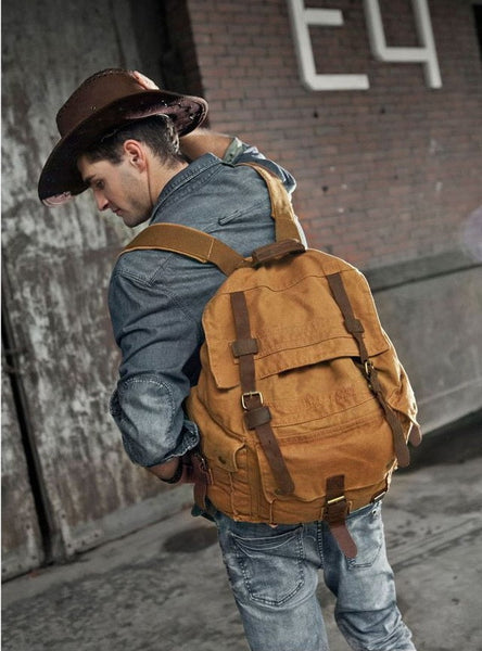 Sexy guy sporting the vintage brown Serbags canvas travel backpack 