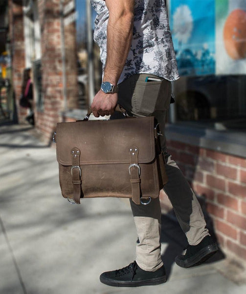 stylish man carrying the handcrafted distressed leather laptop briefcase by Serbags