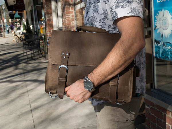 man wearing the handcrafted distressed leather laptop briefcase by Serbags