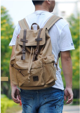 man wearing light brown canvas school backpack by Serbags