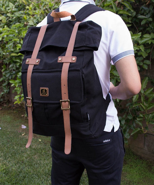 Man wearing Roll top vintage rucksack backpack by Serbags 