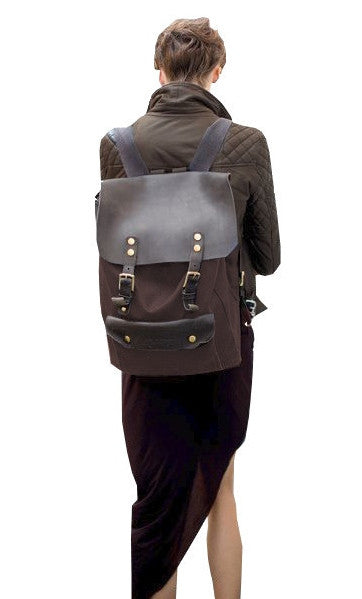 Woman wearing vintage casual canvas leather student backpack by Serbags
