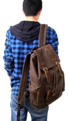 man wearing beautiful dark brown vintage canvas backpack by Serbags