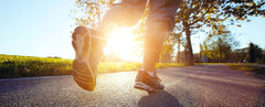 Running on paved path in sunlight