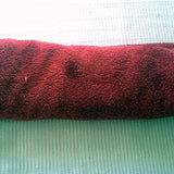 Dry felted hat by rolling it up in a clean, dry towel.