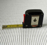 Stiff, metal tape measure that is NOT useful for measuring head size.
