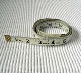Flexible dressmakers cloth tape measure for measuring hat head size.