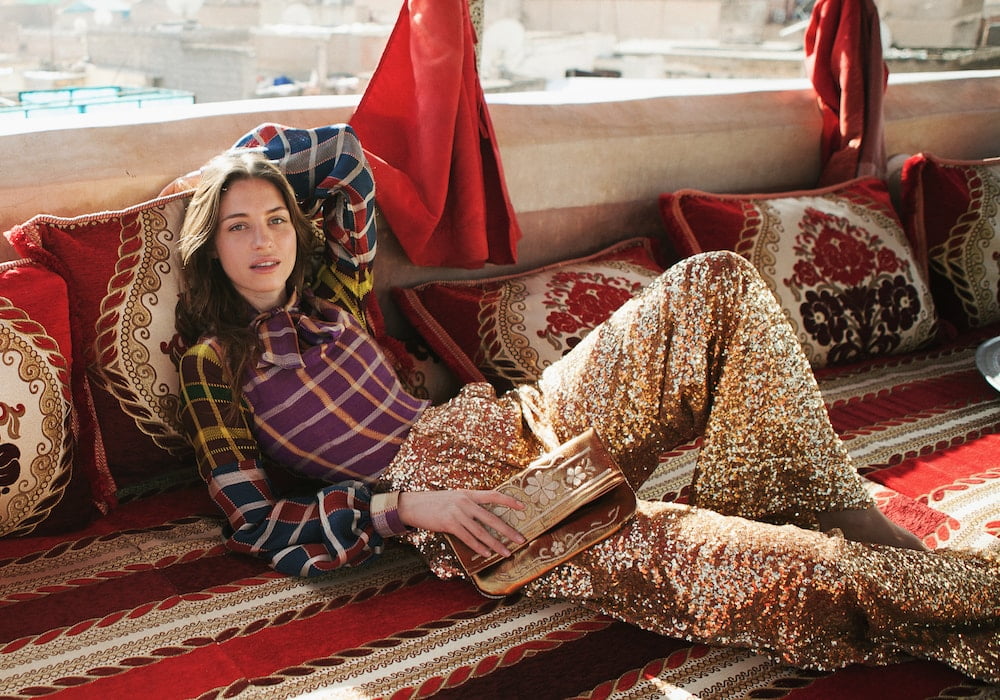 model laying in a moroccan living room